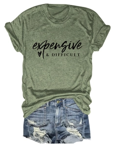 Flat lay of moss green T-shirt with expensive print and distressed denim shorts