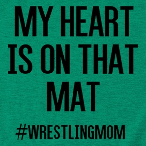 Detail shot of the wrestling mom slogan print on green cotton fabric with knit texture