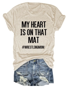 Detail of casual Wrestling Mom print T-shirt paired with distressed blue denim shorts
