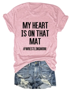 Flat lay of pink t-shirt with My Heart print and distressed denim shorts set