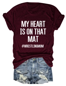 Detail of burgundy My Heart Is On That Mat t-shirt and distressed denim shorts set