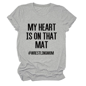 Flat lay of a grey crew neck t-shirt with black #WRESTLINGMOM and slogan print details
