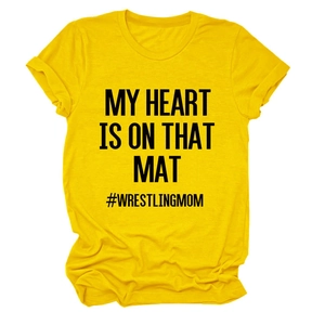 Detail of yellow cotton T-shirt featuring My Heart Is On That Mat and Wrestling Mom print