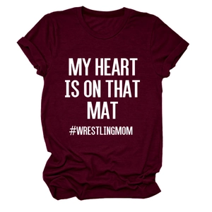 Detail of burgundy T-shirt showing My Heart Is On That Mat wrestling mom text print