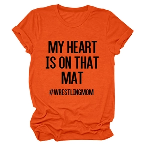 Detail of orange cotton t-shirt with #WRESTLINGMOM text and rolled sleeve cuffs