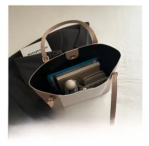 Internal view of a large tote bag showing high capacity for tablets and daily essentials