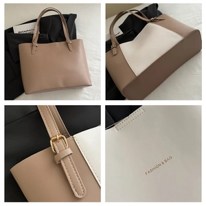 Close-up of golden metal adjustment buckles and premium PU leather texture on tote bag