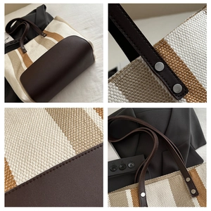 Detail view of striped canvas tote bag showing handle rivets and premium woven texture