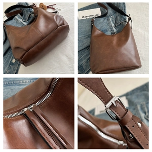 Detailed views of vintage brown leather crossbody bag with silver zippers and buckle strap