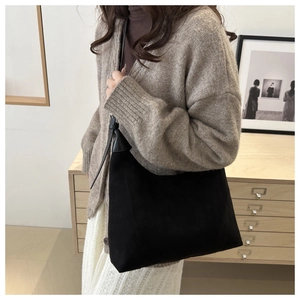 Minimalist black oversized tote bag with premium soft suede and leather texture detail