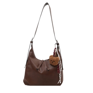 Deep brown large capacity hobo bag with cute bear charm and decorative ribbon