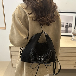 Faux suede tote bag with butterfly detail and criss-cross laces for a chic look