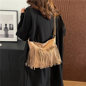 Brown suede fringe shoulder bag with bohemian style tassels and adjustable strap
