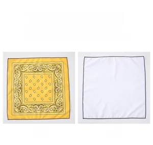 Detail view showing yellow paisley bandana print and white reverse side with grey piping