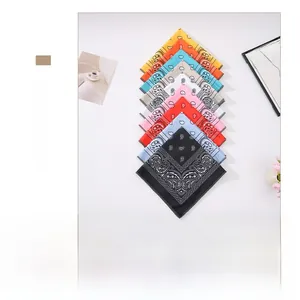 Flat lay of colorful paisley bandanas in various shades for hip hop and outdoor wear