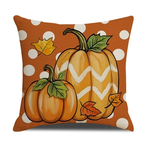 Fall harvest throw pillow cover with pumpkin and maple leaf print on polka dot background
