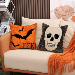 Halloween linen pillow covers featuring orange bat print and black skull design for decor