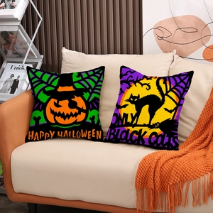 Halloween decorative pillow covers with pumpkin and black cat designs on beige sofa