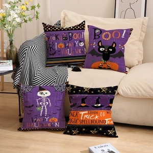 Set of 4 Halloween throw pillow covers with pumpkin, bat and skull designs on a sofa