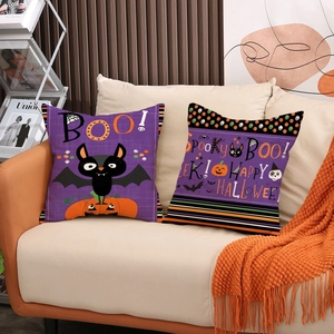 Halloween throw pillow covers set with bats and pumpkins on a modern beige sofa