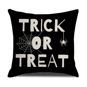 Halloween Trick or Treat pillow cover with spider web design on black linen fabric