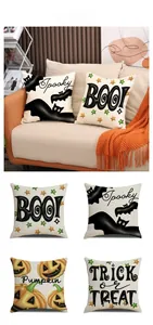 Close-up of four Halloween pillow covers with bat and pumpkin prints on linen fabric