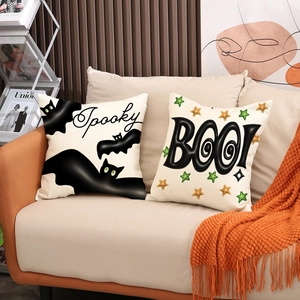 Halloween pillow covers with Spooky bat and BOO! print on a cozy sofa setting