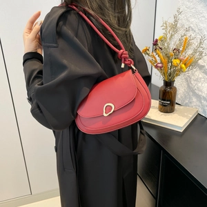 Minimalist red leather underarm bag for women with gold buckle and knotted strap