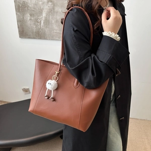 Brown faux leather tote bag with plush charm, large capacity shoulder bag for women