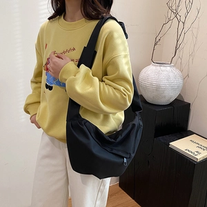 Versatile black crescent crossbody bag with wide strap for casual daily use