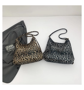 Close-up of leopard print hobo tote bags showing large capacity and soft material