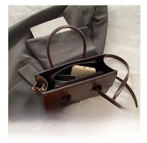 Deep brown tote bag showing spacious interior for smartphone and daily essentials