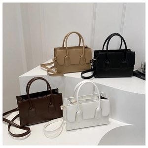 Detail of minimalist leather crossbody bags in khaki, black, dark brown, and white colors