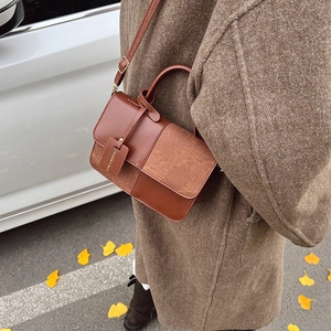 Minimalist brown PU leather crossbody bag with vintage flap and top handle in autumn