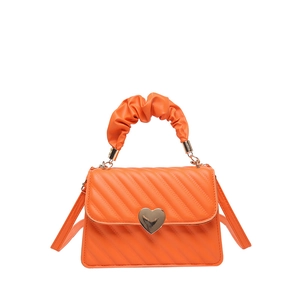 Bright orange pleated handbag with gold heart clasp and crossbody strap on white background