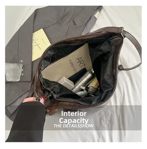 Top view of the deep brown leather tote bag interior showing large storage capacity