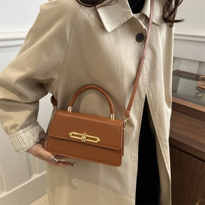 Vintage brown leather crossbody bag with gold lock buckle and top handle for women
