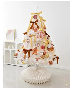 Detailed view of white Christmas tree with festive bows and warm LED fairy lights