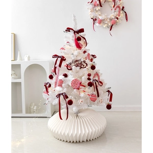 White Christmas tree set with red bows, ornaments, and folding base for holiday decor