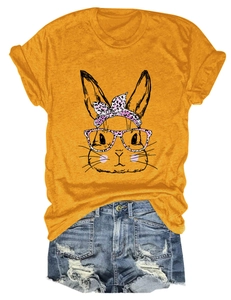 Flat lay of women's yellow t-shirt with leopard bunny print and denim shorts outfit