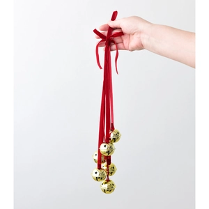 Christmas decoration with 6 gold star-cutout metal bells and a red velvet bow ribbon