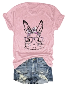 Close-up of pink t-shirt with artistic rabbit print and distressed denim shorts