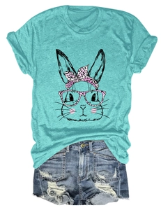 Detail of turquoise rabbit print t-shirt paired with distressed denim fringe shorts