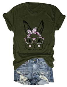 Detailed flat lay of an olive green t-shirt with a pink leopard print bunny and denim shorts