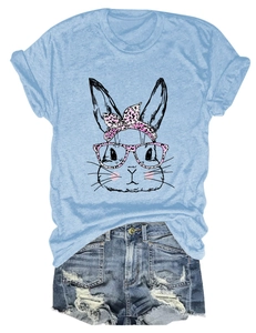 Flat lay of pink leopard print rabbit graphic tee and distressed denim shorts outfit