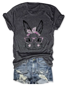 Flat lay of gray T-shirt with pink leopard bunny print and distressed denim shorts