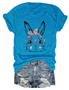Detailed view of cartoon rabbit print with pink leopard glasses on blue cotton t-shirt