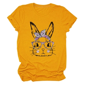 Detailed close-up of a mustard yellow T-shirt with a cartoon rabbit and leopard bow
