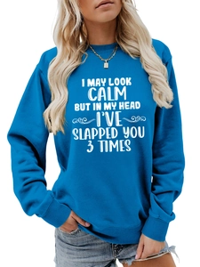 Close-up of blue cotton sweatshirt featuring white art typography slogan on the chest