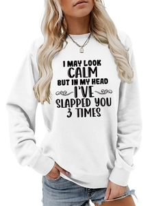 Detail of white long sleeve sweatshirt with humor slogan I MAY LOOK CALM print